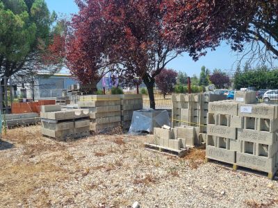 a lot of concrete blocks sitting in the dirt
