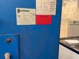 a blue door with a sign on it in a building