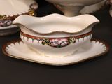 a bowl and saucer on a table with a bowl and saucer