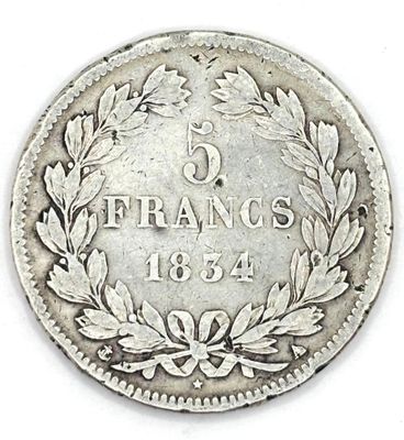 a close up of a coin on a white surface