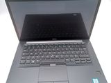 a laptop with a keyboard on it sitting on a table