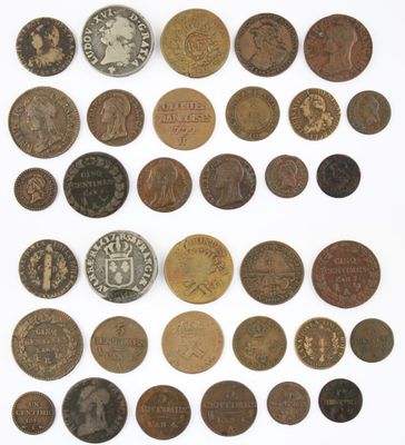an image of a collection of old coins on a white surface
