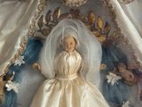 a doll of a woman in a wedding dress in a box