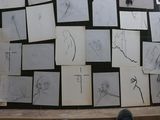 a lot of drawings on the wall of a room