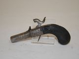 an old gun that is on display on a table