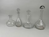 three glass vases sitting next to each other on a table