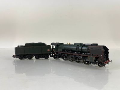 a toy train that is sitting on a white surface