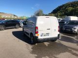 a white van that is parked in a parking lot