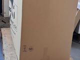 a large cardboard box sitting on a pallet in a warehouse