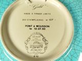 a blue plate with a picture of a castle on it