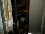 a refrigerator and a microwave in a small room