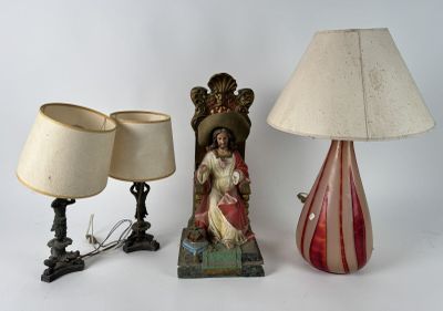 two lamps and a statue of a woman on a table