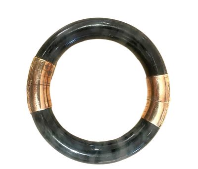 an image of a black and gold bracelet on a white background