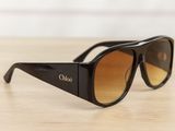the sunglasses are black and have brown lenses on them