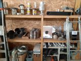 a shelf with many different tools on it in a room