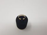 a black ring with a gold ring on top of it