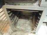 a dirty oven that has a lot of food inside of it