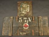 a wooden sign with a red cross and a coat of arms
