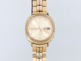 an image of a woman ' s wrist watch on a white surface
