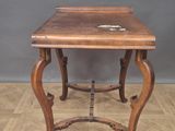 an image of a small wooden table sitting on top of a hard wood floor