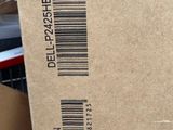 a cardboard box with a barcode on it sitting on a desk