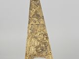 a gold cone shaped object on a clear stand with a white background