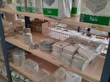 many bags of food on the shelves in the store