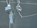 a couple of hooks hanging from the ceiling of a building