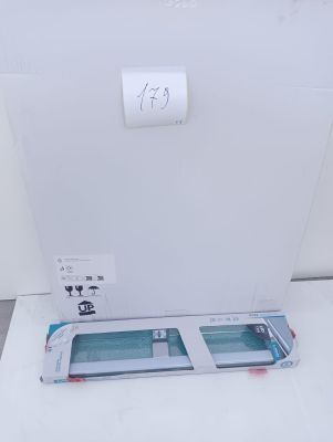 a white toilet with a paper dispenser next to it