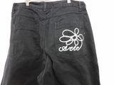 a close up of a pair of black jeans with a bow on the back