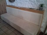 a couch that is sitting in front of a wall