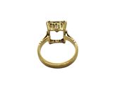 a close up of a gold ring with a diamond on it