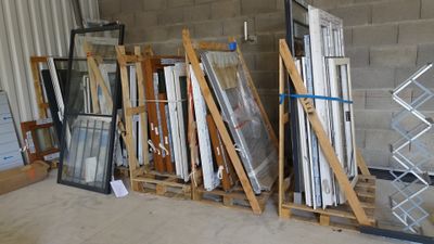 many different types of windows and doors in this warehouse