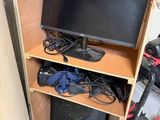 a tv that is sitting on top of a wooden cabinet