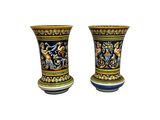 pair of ceramic vases with colorful designs on them on a white background