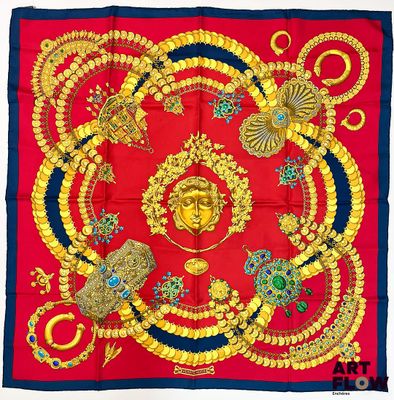une image représentant un carré rouge et bleu orné de motifs dorés