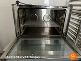a silver oven with a glass door inside of it
