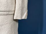 a close up of a white suit on a mannequin mannequin mannequin mannequin mannequin mannequin mannequin manne