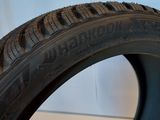 a close up of a tire on a white surface