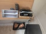 an image of a room with a heater and a chair