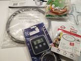 a digital timer and a pair of scissors on a table