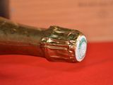 a close up of a bottle of champagne on a table