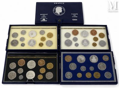 four different types of coins in a display case