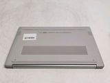 a laptop that is sitting on a white surface