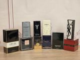 many different types of perfumes sitting on a table
