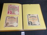 three different types of paper money are on display in a book
