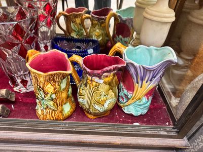 many vases that are sitting on a table