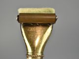 an image of a close up of a gold colored razor