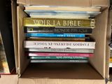 a box full of books that are stacked on top of each other