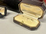 a box with a ring inside of it and a box with a ring inside of it